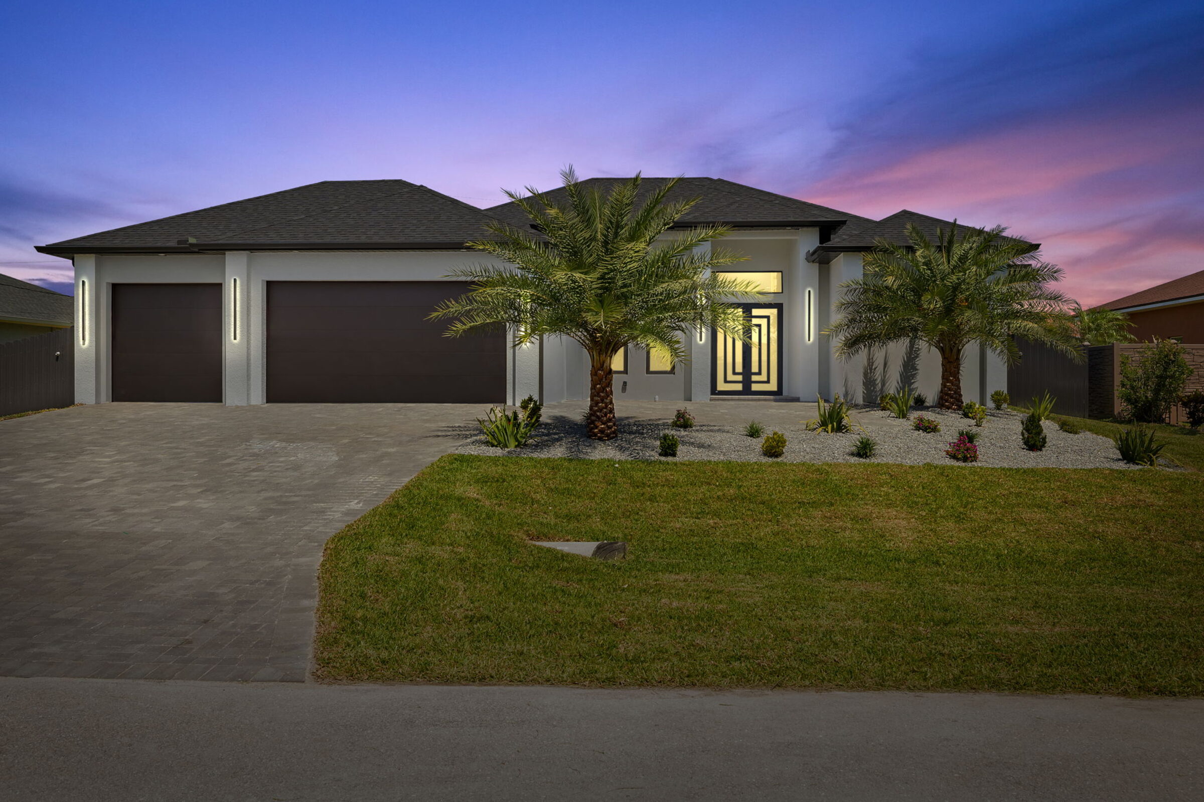 Sunset Model — front elevation at dusk